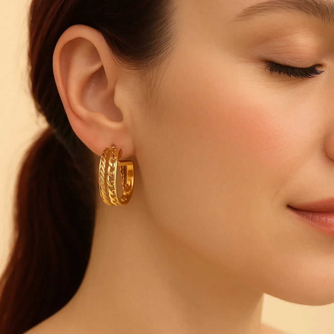 Candongas en acero inoxidable con cierre tipo topo y baño dorado