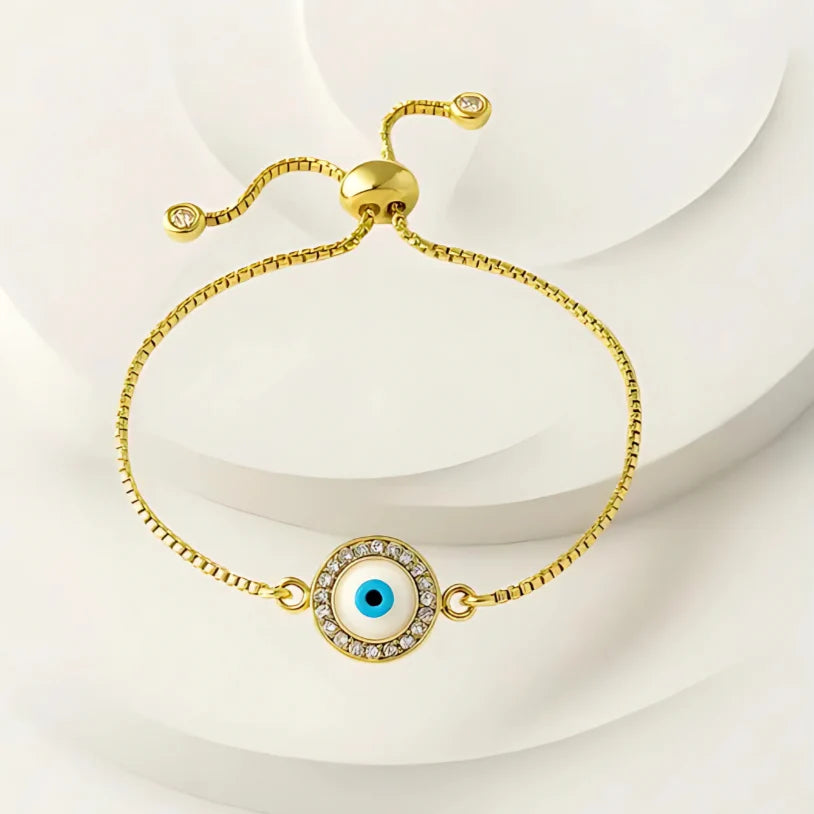 Pulsera con dije de ojo turco y cordón dorado. Accesorios mujer