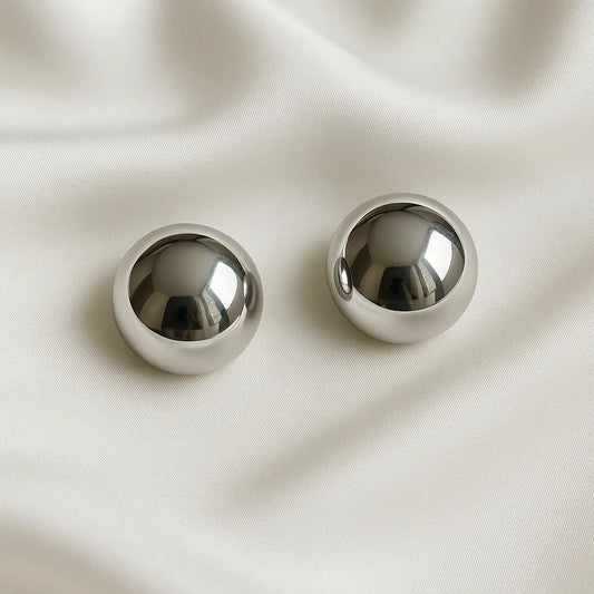 Aretes Topos Sun Plateado de acero inoxidable con acabado efecto espejo