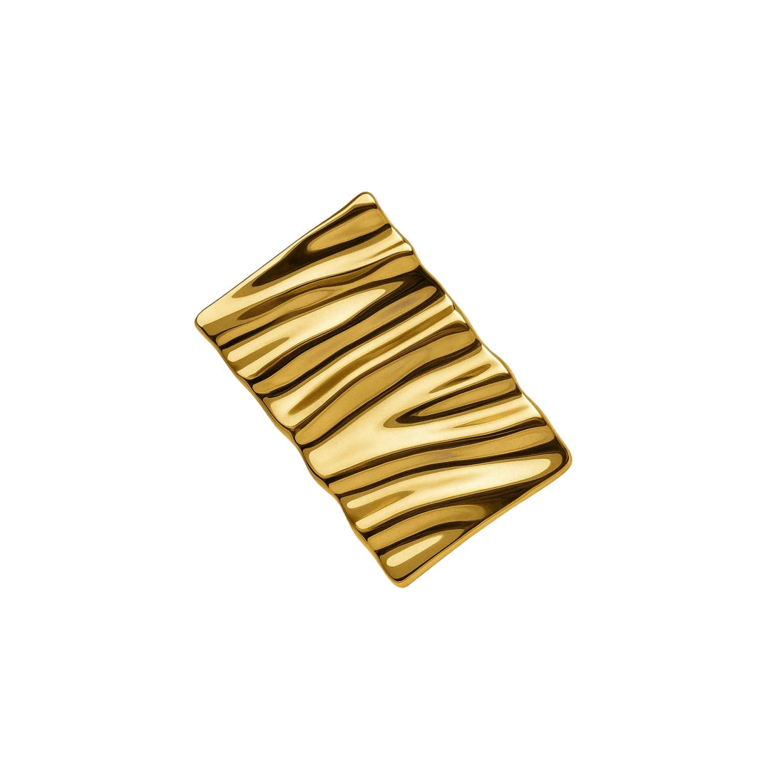 Clip dorado con baño de oro 24K sobre tela

