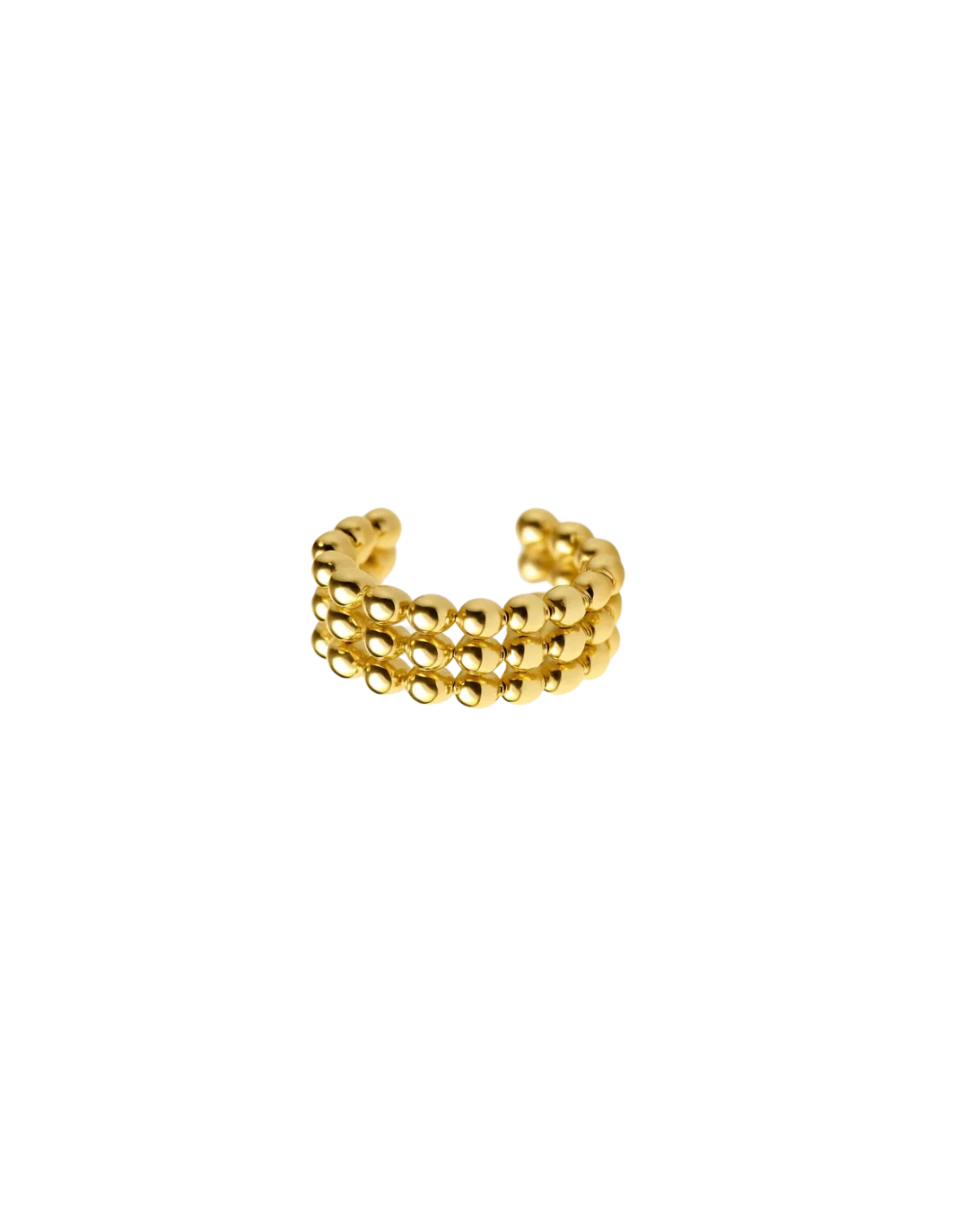 Vista lateral de joya dorada estilo ear cuff

