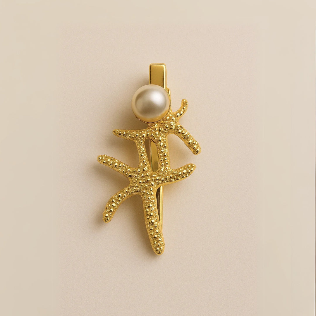 Estrella de mar dorada con relieve y acabado brillante

